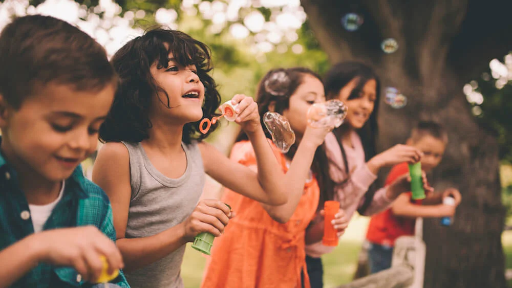 Children blowing bubbles